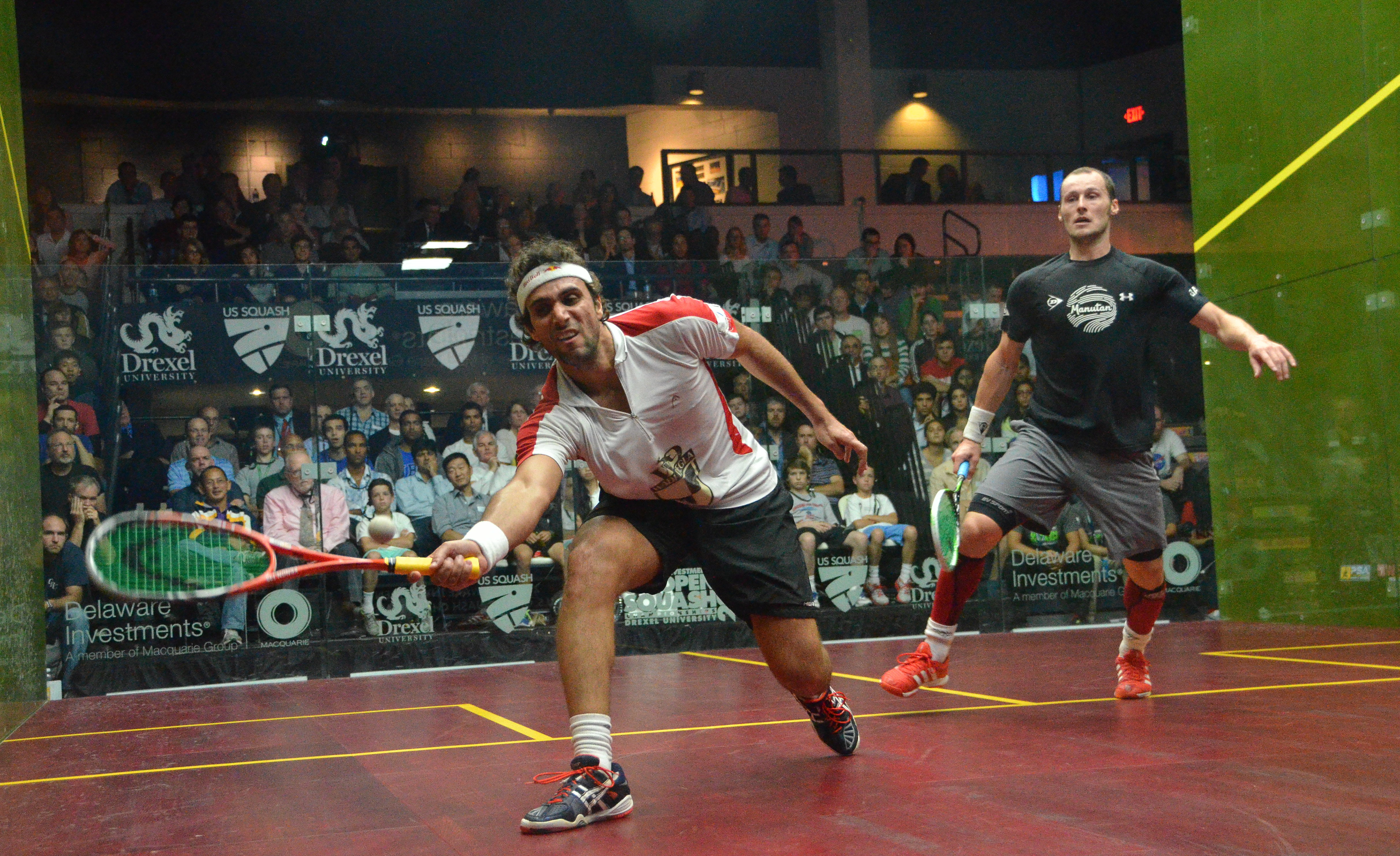 Karim Darwish (L) against eventual champion Gregory Gaultier in the 2013 U.S. Open semifinals.